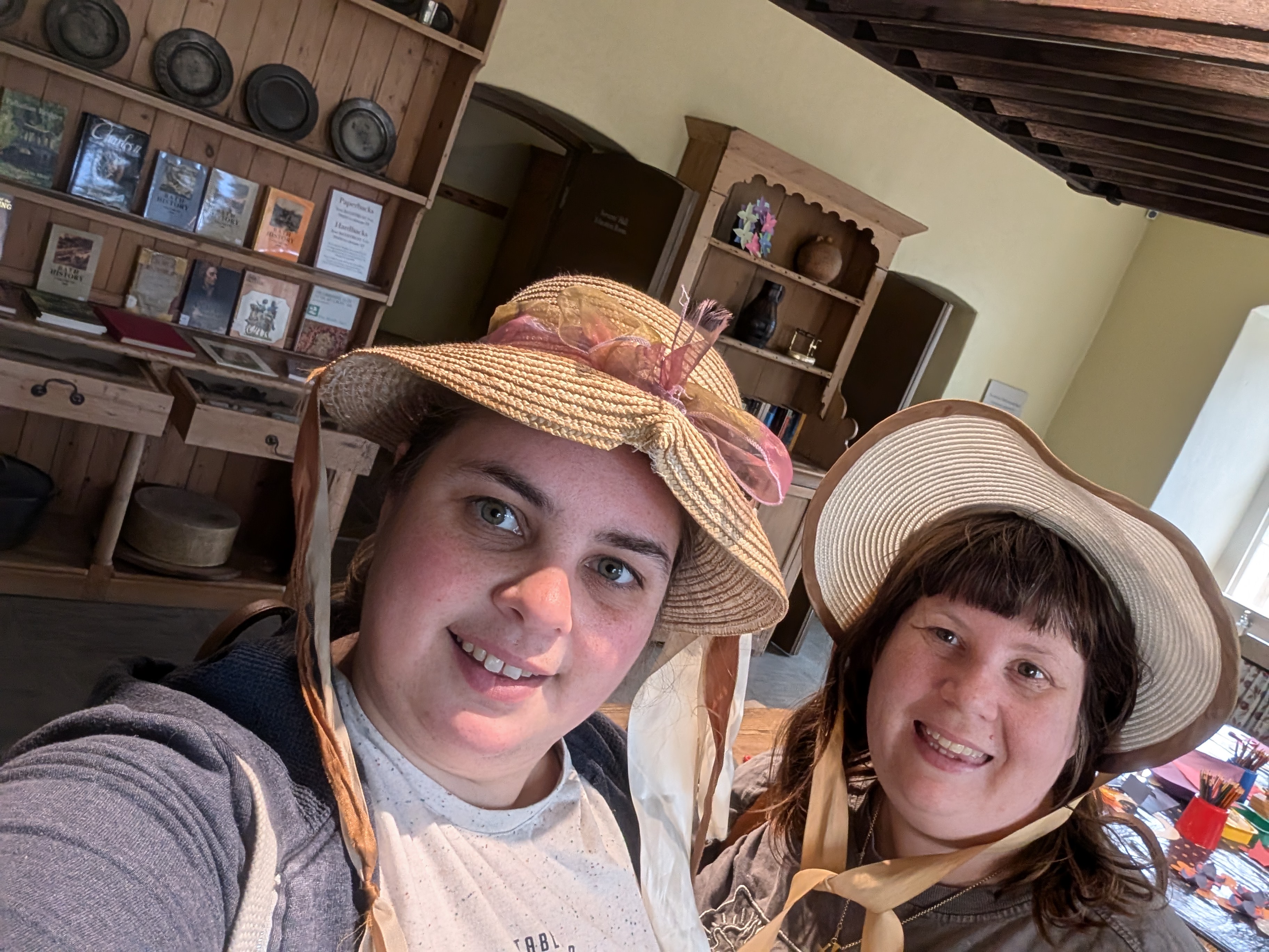 Nathalie and Sarah trying on hats